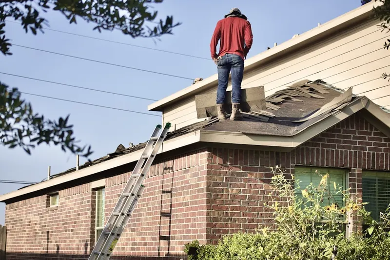 Professional roofer working on a residential roof in Lansdale